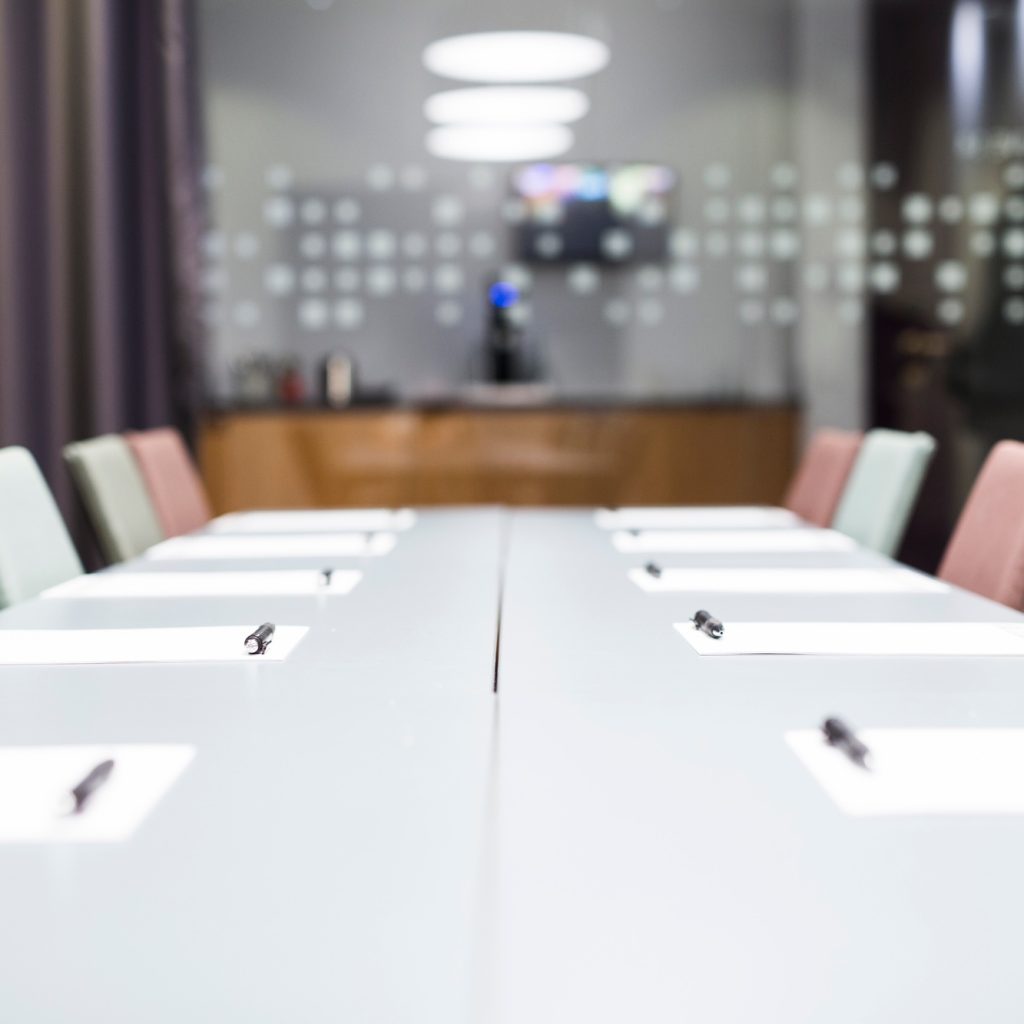 Papers and pen on conference table in office